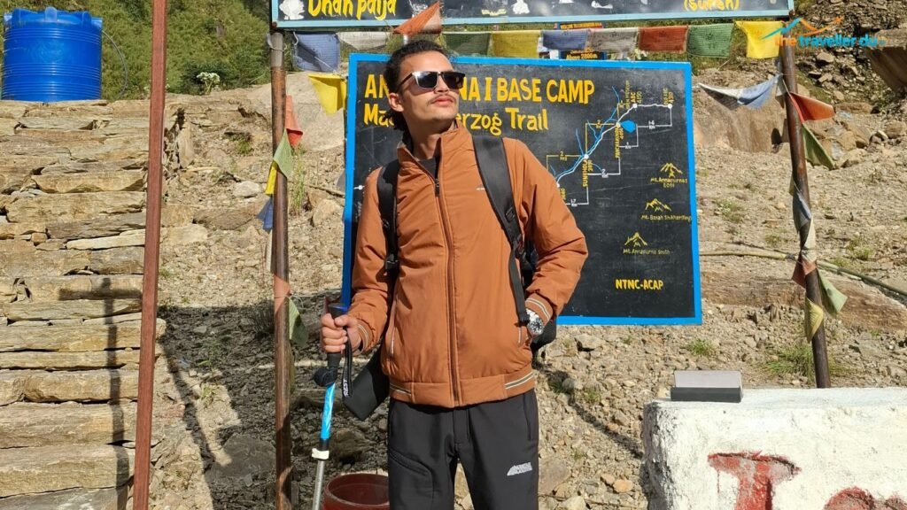 Trekker at the Annapurna I Base Camp Maurice Herzog Trail map board, North ABC trek, Myagdi